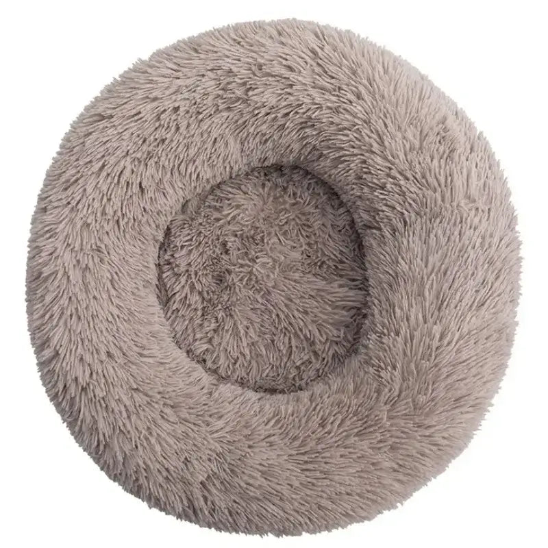 Fluffy calming pet bed in soft plush material, designed for ultimate comfort and security for dogs.