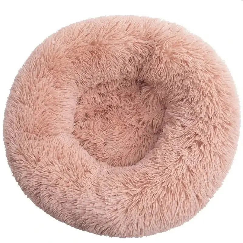 Fluffy calming pet bed in soft pink color, perfect for large dogs to relax and nap comfortably.
